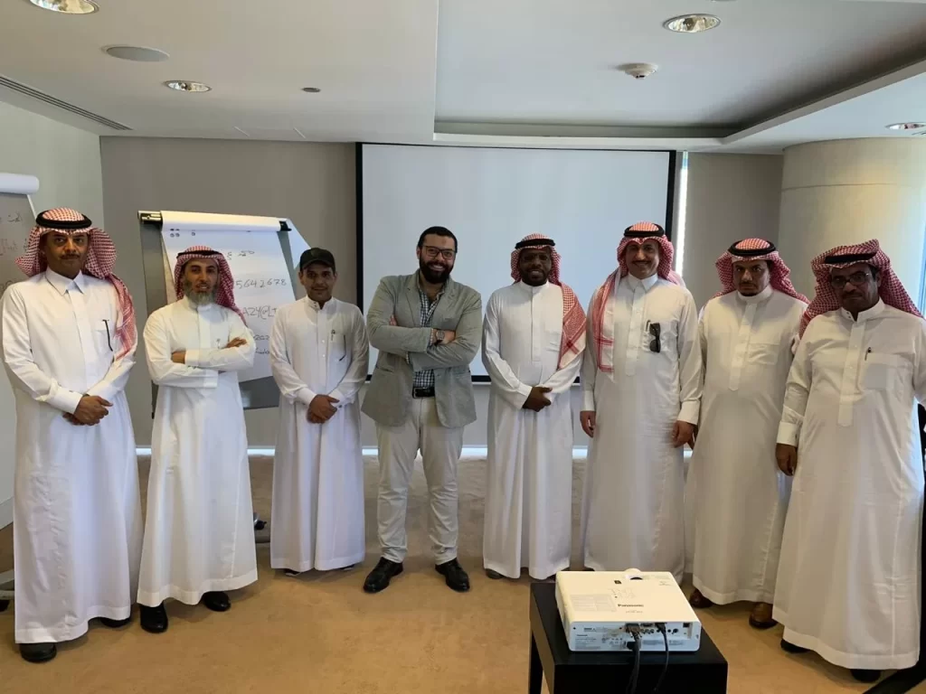 Workshop participants standing together after a session