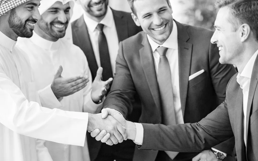 Business partners shaking hands after a client meeting